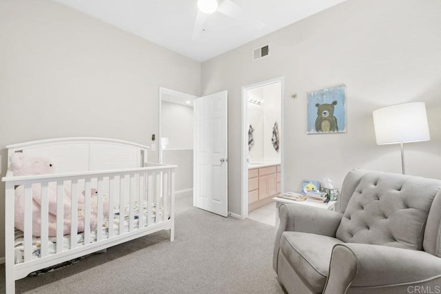 18562 Caminito Pasadero, San Diego, CA 92128 - bedroom with a ceiling fan, ensuite bathroom, visible vents, baseboards, and light carpet