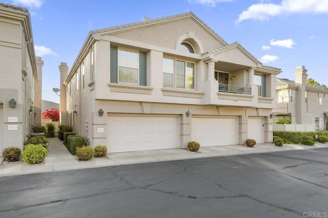 18562 Caminito Pasadero, San Diego, CA 92128 - view of property with concrete driveway, stucco siding, and a garage