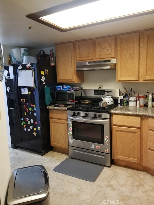 426 N Maryland Ave Unit 103, Glendale, CA 91206 - kitchen featuring under cabinet range hood, gas range, light tile patterned flooring, and black fridge with ice dispenser