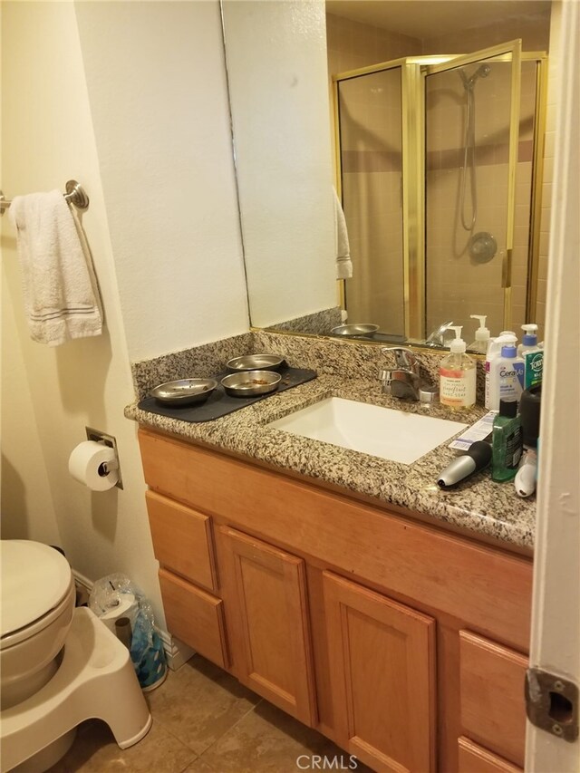 426 N Maryland Ave Unit 103, Glendale, CA 91206 - full bath featuring vanity, toilet, tile patterned flooring, and a shower stall