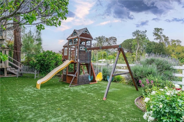 view of jungle gym with a lawn