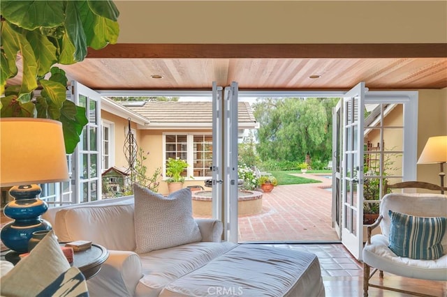 entryway with wood ceiling and french doors
