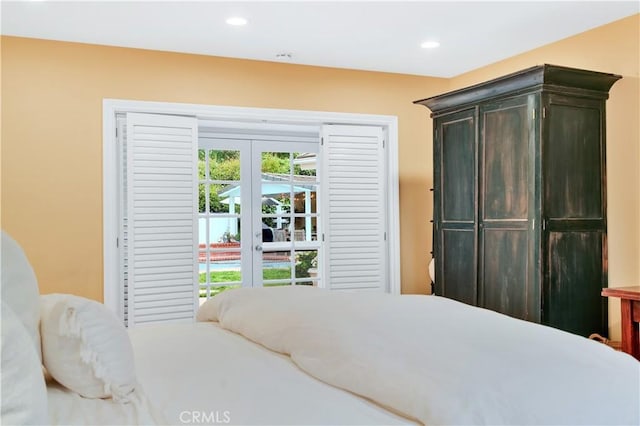bedroom with access to outside and recessed lighting