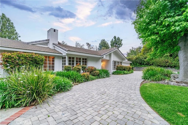 exterior space with decorative driveway