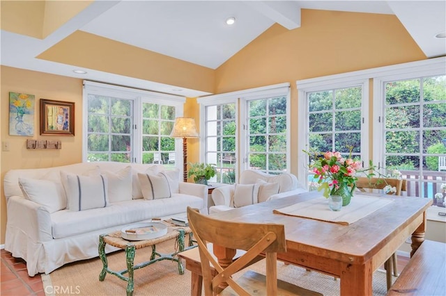 sunroom featuring a wealth of natural light, lofted ceiling with beams, french doors, and recessed lighting