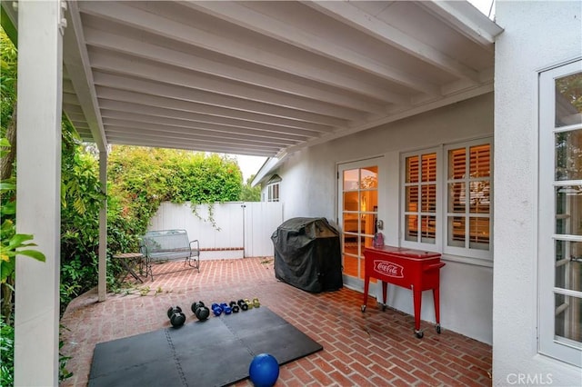 view of patio with fence and grilling area