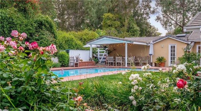 view of swimming pool featuring fence and a fenced in pool