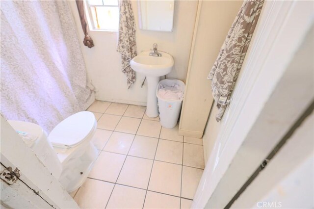1341 N Fries, Wilmington, CA 90744 - bathroom featuring tile patterned floors, toilet, baseboards, and a sink