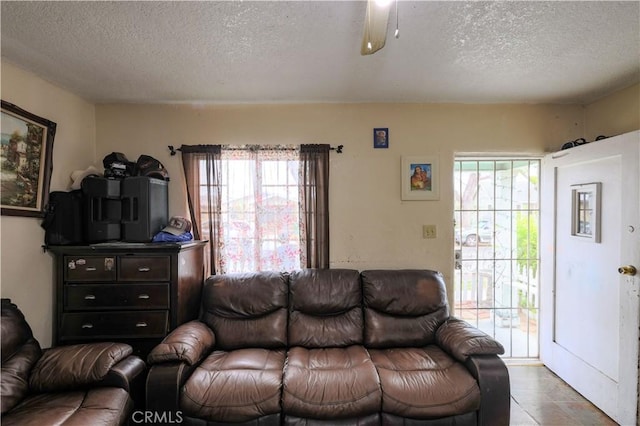 1341 N Fries, Wilmington, CA 90744 - living area featuring a textured ceiling, a ceiling fan, and tile patterned floors