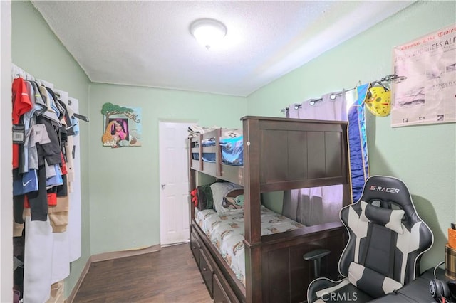1341 N Fries, Wilmington, CA 90744 - bedroom with a textured ceiling, baseboards, and wood finished floors