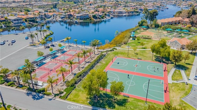 birds eye view of property featuring a water view and a residential view