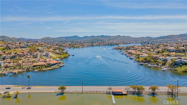 water view with a residential view and a mountain view