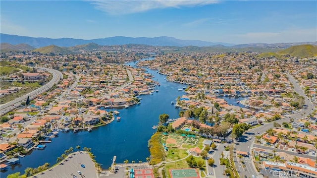 aerial view featuring a water and mountain view and a residential view