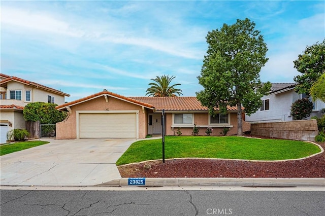 single story home with an attached garage, a tiled roof, fence, concrete driveway, and a front yard