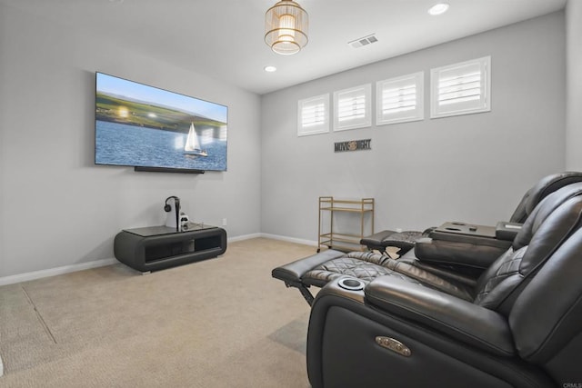carpeted living room featuring baseboards, visible vents, and recessed lighting