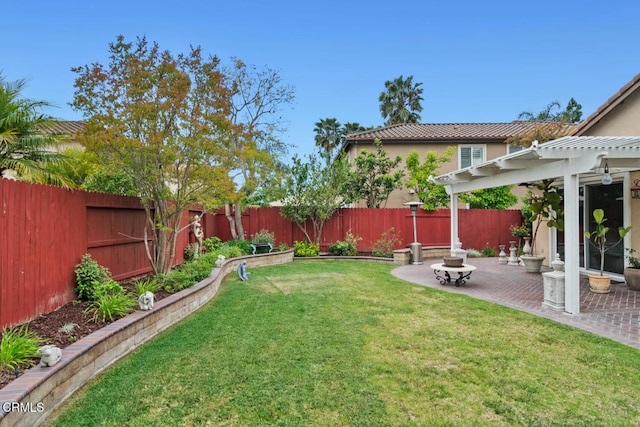 view of yard featuring a patio area, a pergola, and a fenced backyard