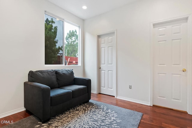 sitting room featuring wood finished floors, baseboards, and recessed lighting