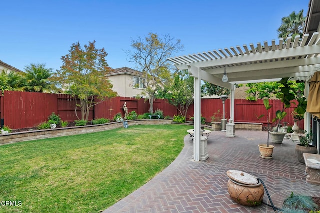 view of yard featuring a patio, a pergola, and a fenced backyard