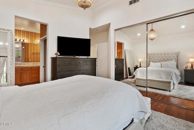 bedroom with recessed lighting, ornamental molding, hardwood / wood-style floors, and visible vents
