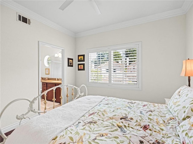 bedroom featuring crown molding, baseboards, ceiling fan, and ensuite bath