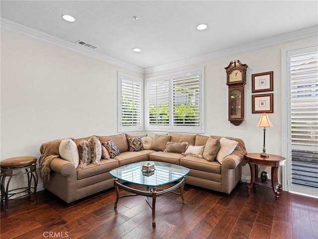 living area featuring dark wood finished floors, recessed lighting, ornamental molding, and baseboards
