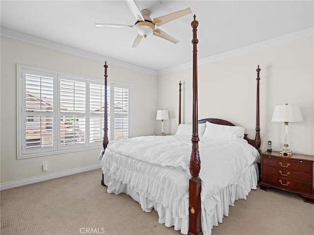 bedroom with light colored carpet, crown molding, baseboards, and ceiling fan
