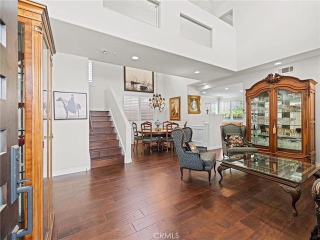 entrance foyer with stairs, wood finished floors, recessed lighting, and baseboards