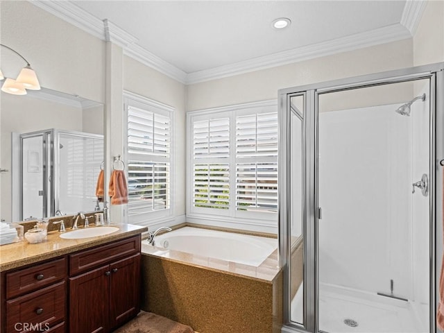 full bathroom with a shower stall, vanity, a bath, and ornamental molding