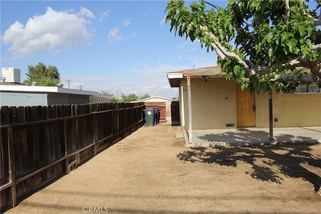view of yard with a patio and fence