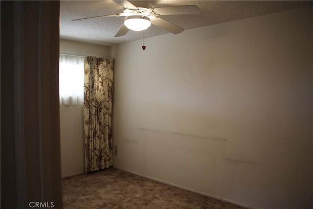 unfurnished room with carpet, a textured ceiling, and ceiling fan