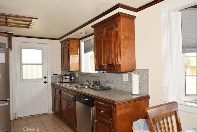 56819 Mountain View Trl, Yucca Valley, CA 92284 - kitchen with stainless steel appliances, plenty of natural light, decorative backsplash, light tile patterned floors, and ornamental molding