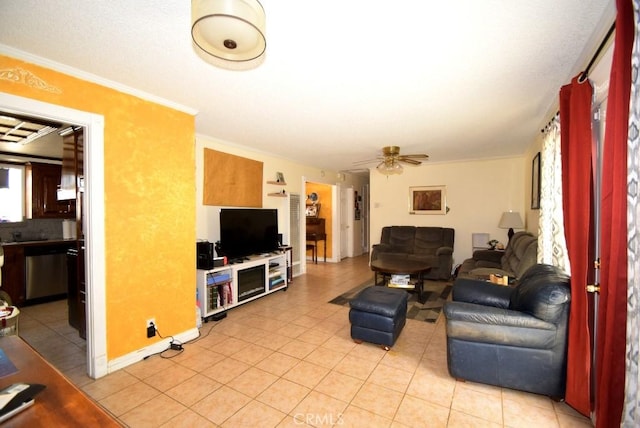 living room with crown molding, a ceiling fan, and light tile patterned floors