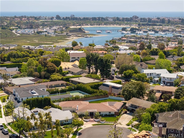 birds eye view of property featuring a water view and a residential view