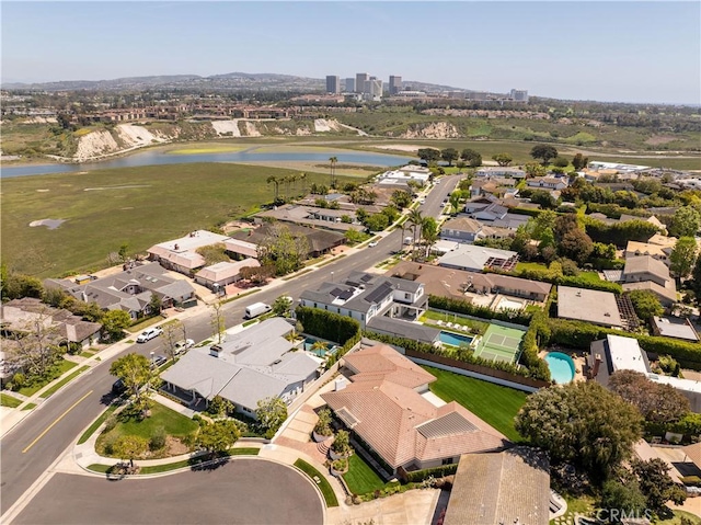 birds eye view of property with a water view and a residential view