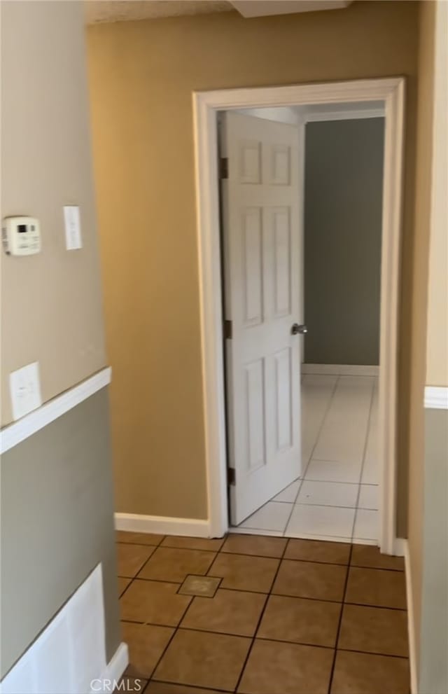 hallway featuring light tile patterned floors