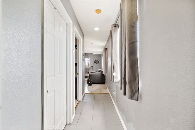 1301 E Pacific Coast, Wilmington, CA 90744 - corridor with light tile patterned flooring, a textured wall, recessed lighting, and baseboards