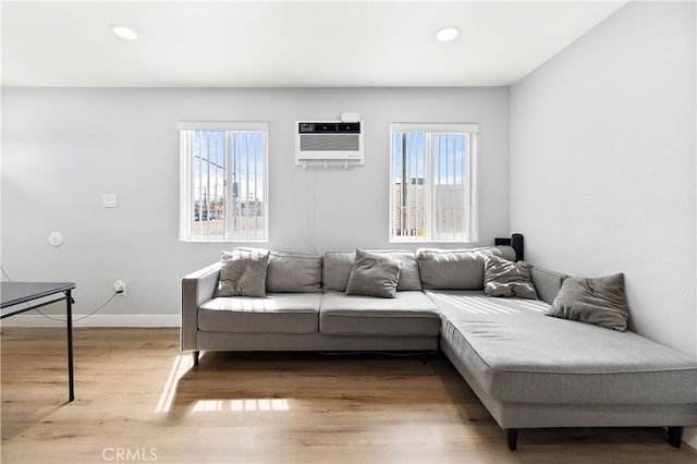 1301 E Pacific Coast, Wilmington, CA 90744 - living room with plenty of natural light, wood finished floors, recessed lighting, a wall mounted AC, and baseboards