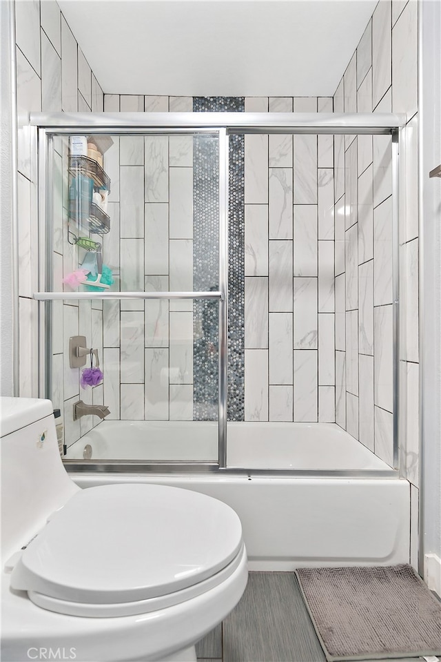 1301 E Pacific Coast, Wilmington, CA 90744 - full bathroom featuring toilet and shower / bath combination with glass door