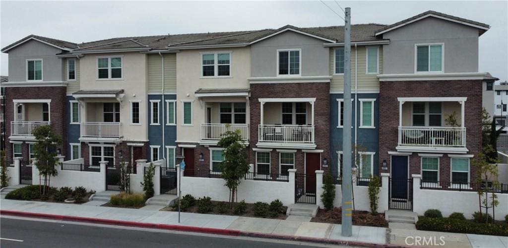 multi unit property with brick siding and stucco siding