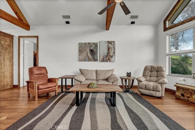 living room featuring visible vents, ceiling fan, vaulted ceiling with beams, and wood finished floors