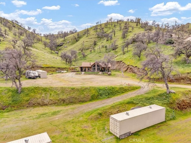 birds eye view of property featuring a rural view and a mountain view