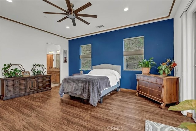 bedroom with recessed lighting, visible vents, and wood finished floors