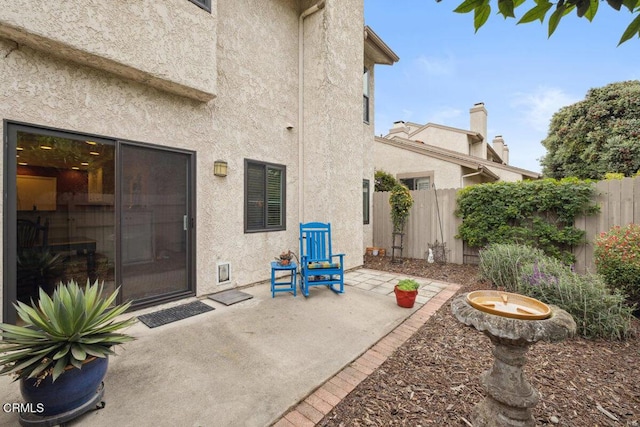 view of patio / terrace featuring fence