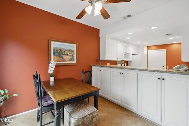 dining room with visible vents, baseboards, ceiling fan, and recessed lighting