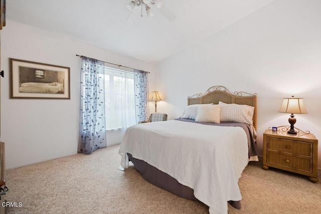 bedroom featuring vaulted ceiling and carpet