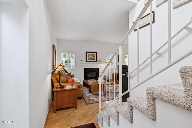 interior space with a fireplace and wood finished floors