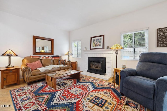 living area with a brick fireplace
