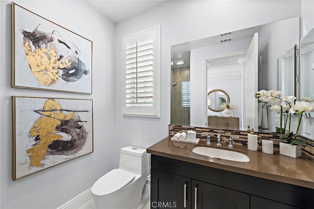 109 Chronology, Irvine, CA 92618 - full bathroom with toilet, vanity, tasteful backsplash, and a shower