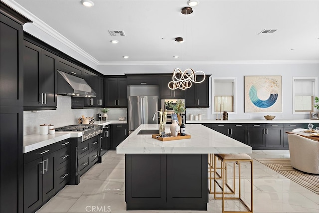 109 Chronology, Irvine, CA 92618 - kitchen featuring range hood, stainless steel appliances, dark cabinetry, crown molding, and light marble finish flooring
