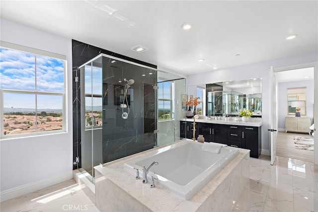 109 Chronology, Irvine, CA 92618 - bathroom with a stall shower, vanity, a garden tub, baseboards, and recessed lighting